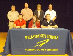 Wellston High School’s Ariel Patrick is joined by administrators and coaches as she signs to continue her track & field career at the University of Rio Grande. Pictured are, from left to right, (seated) Rio Grande director of track & field/cross country Steve Gruenberg, Ariel Patrick, Rio Grande assistant coach Nick Wilson; (standing) Wellston High assistant principal Mike Lackey, Wellston High track & field head coach Brian Mantell, Wellston High principal Megan Sowers, Wellston High athletic director Jeff Hendershott.