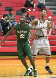 Rio Grande’s Bilal Young watches the flight of a free throw as Wilberforce’s Devontae Berry grabs his jersey during the second half of Saturday’s game at the Newt Oliver Arena.