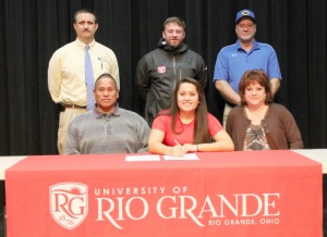 Portsmouth Clay High School standout Shannon Curley poses with her parents, coaches and school administrators prior to signing a letter-of-intent to continue her soccer career at the University of Rio Grande. Pictured are, from left to right, (seated) Nate Curley, Shannon Curley, Susan Curley; (standing) Clay High principal Todd Warnock, Rio Grande head coach Callum Morris and Clay High head coach Roger Compton.