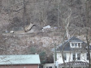 The hill side behind the houses can be seen at distance. Photo by Carrie Gloeckner.