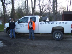 Meigs SWCD staffers Bill and Joe Foley, from left, pose with the Meigs County – Pick It Up! truck. The Foleys, along with other helpers, have picked up over 250 bags of litter from almost 50 miles of county roadway since the beginning of the year.  