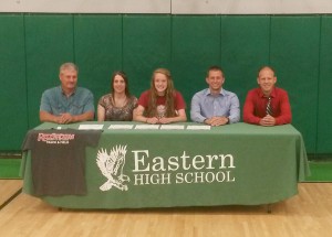 Eastern High School's Keri Lawrence poses with her parents and Rio Grande coaches after signing to continue her track & field career with the RedStorm. Pictured are, from left to right, (seated) Tim Lawrence, Kenda Lawrence, Keri Lawrence, Rio Grande director of track & field/cross country Steve Gruenberg, Rio Grande assistant coach Nick Wilson.  