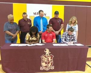 Meigs High School track & field standouts Jordan Hutton and Adrianna Rowe are joined by family, coaches and adminstrators as they sign to continue their respective careers at the University of Rio Grande. Pictured are , from left to right, (seated) Adrianna Rowe, Rio Grande coach Steve Gruenberg, Jordan Hutton; (standing) Dreama English, Meigs High track coach Mike Kennedy, Meigs High School principal Steve Ohlinger, Chris Hutton and Shelly Adams.