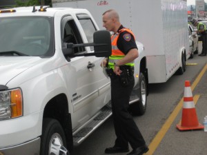 Patrol Adam Holcomb speaking with a driver during the checkpoint.