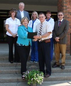 Left to right – front row, Amy Showalter, BSN, MBA, Chief Nursing Officer, Holzer Health System, and Brent Saunders, Gallia County Commissioner. Second row, left to right: Sarah Waddell, RN, Clinical Manager, Holzer Health System, Lacey Bailey, BSN, RN, Nurse Educator, Holzer Health System, Lisa Stepp, BSN, RN, Nurse Navigator, Holzer Health System, and David Smith, DDS, Gallia County Commissioner. Last row, Harold Montgomery, Gallia County Commissioner. 