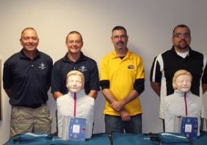 Captain Eric Rock, Director Robert Jacks, Elks Grant Coordinator Steve Marxen and Meigs County Commissioner Randy Smith with new CPR mannequins and AED trainers.
