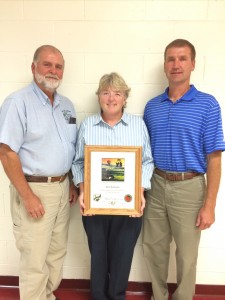 Kim Romine, center, Pomeroy, was recognized by the Ohio Department of Natural Resources-Division of Soil and Water Resources, for her six years of service as a member of the Meigs Soil and Water Conservation District Board of Supervisors. She is shown with Meigs SWCD program administrator Steve Jenkins, left, and Rob Hamilton, program specialist with ODNR-Division of Soil and Water Resources.