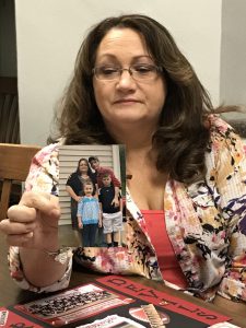 Kimberly Horn, Brandon Lupardus' mother, displays the last picture taken with her son before his murder. Photo by Carrie Gloeckner. 